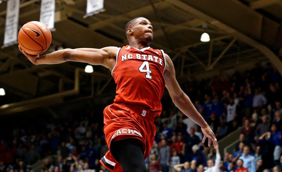 FILE - In this Jan. 23, 2017, file photo, North Carolina State's Dennis Smith Jr. (4) drives to the basket as time expires in the second half of an NCAA college basketball game against Duke, in Durham, N.C.