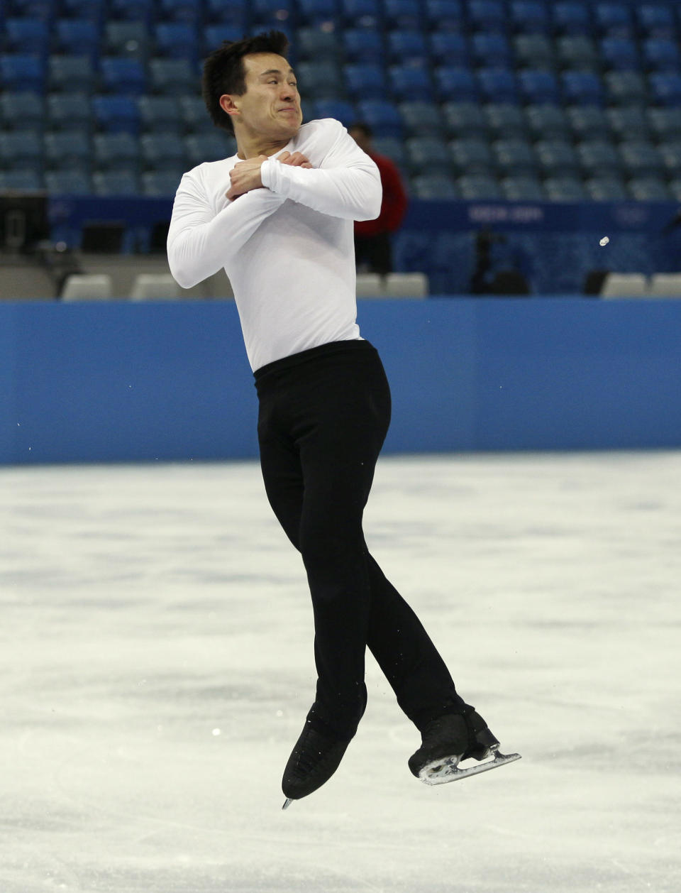 Patrick Chan of Canada practices during a figure skating practice session at the Iceberg Skating Palace ahead of the 2014 Winter Olympics, Monday, Feb. 3, 2014, in Sochi, Russia. (AP Photo/Mark Baker)