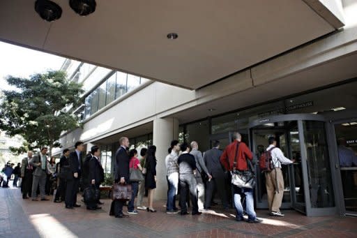 Individuals line up to enter the Robert F. Peckham United States Courthouse Building to watch Apple and Samsung face each other in federal district court for a patent infringement case in July 2012. The judge in the case reprimanded Samsung for releasing excluded evidence on Friday but rejected a bid by Apple to order a verdict in the case