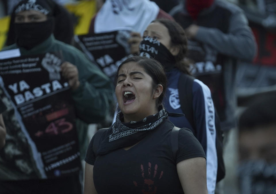 Relatives and sympathizers of 43 missing Ayotzinapa university students march on the 9th anniversary of their disappearance, in Mexico City, Tuesday, Sept. 26, 2023. (AP Photo/Marco Ugarte)