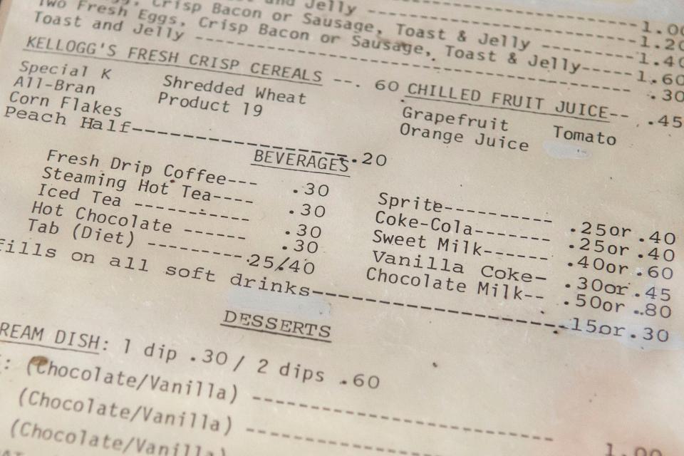 An older menu on display at the lunch counter of Long's Drug Store on July 31, 2023, shows a cup of coffee cost 30 cents.