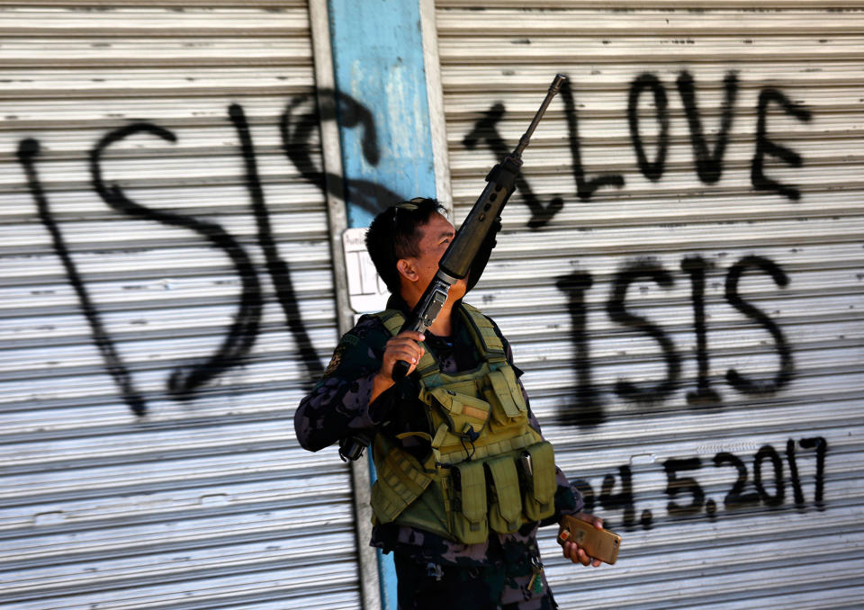 <p>A Filipino government troop conducts patrol on a reclaimed former Maute stronghold in Marawi City, Mindanao Island, southern Philippines on May 30, 2017, as fighting between Islamist militants and government forces continues. According to news reports, more than a 100 people have been killed in ongoing clashes between rebels and the Philippine army in Marawi in southern Philippines, a government spokesperson said. At least four rebels from the Maute group – with links to the so-called Islamic State (IS or ISIS, ISIL) – and two soldiers were killed on 30 May, government spokesperson Ernesto Abella, said in a press conference. Since the clashes broke out a week ago, the number of casualties has climbed to 104, including 19 civilians, 65 rebels, 17 soldiers and three police officers. The clashes began on 23 May when an army offensive to capture Isnilon Hapilon, leader of the terrorist group Abu Sayyaf, also loyal to the IS, and who was sheltered by members of the Maute group in Marawi, had failed. (Francis R. Malasig/EPA) </p>