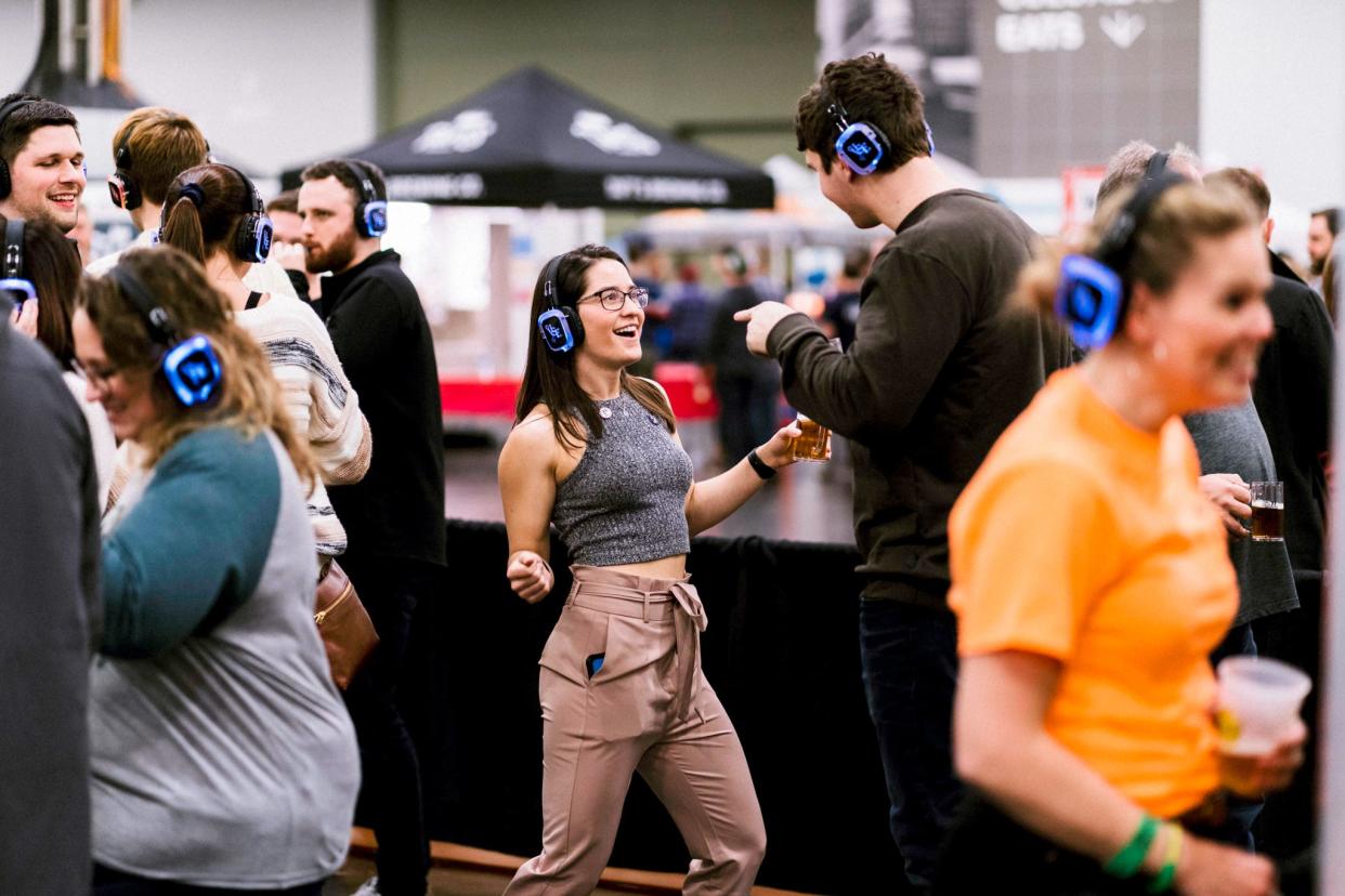 Guests can choose from three songs to enjoy during the silent disco at the Columbus Winter Beerfest on Saturday.
