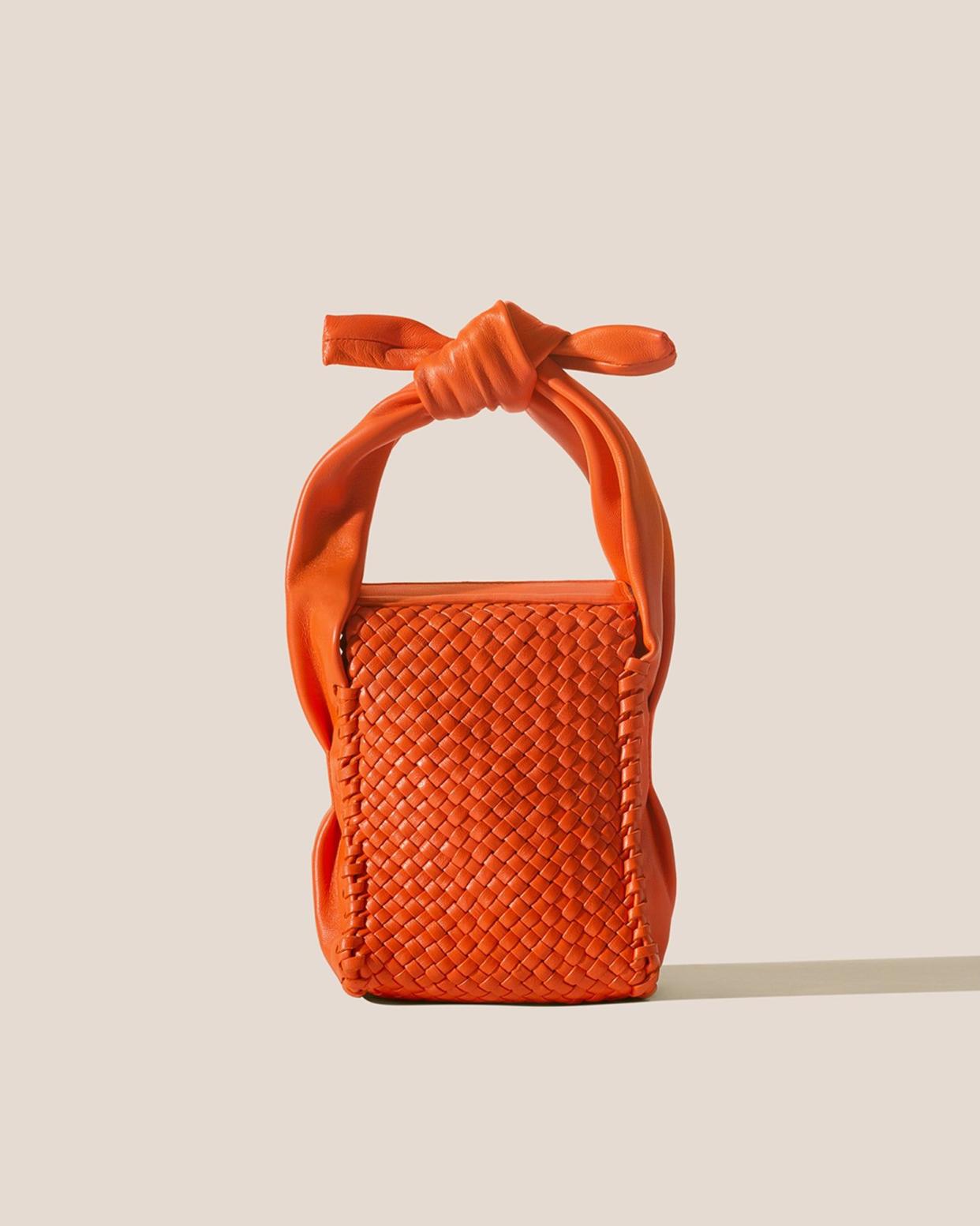 <p><a href="https://hereustudio.com/products/molta-handwoven-mini-box-bag-clementine" rel="nofollow noopener" target="_blank" data-ylk="slk:Shop Now;elm:context_link;itc:0;sec:content-canvas" class="link rapid-noclick-resp">Shop Now</a></p><p>Molta Handwoven Mini Bag</p><p>hereustudio.com</p><p>€550.00</p>