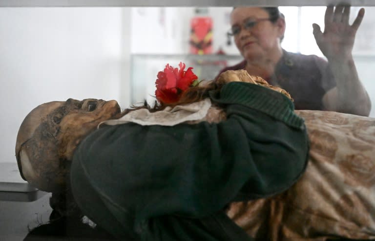 Clovisnerys Bejarano visiting her mother Saturnina Torres, who died in 1993 and was spontaneously mummified (Raul ARBOLEDA)
