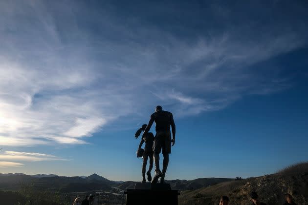 A bronze sculpture honoring former Los Angeles Lakers player Kobe Bryant, his daughter Gianna Bryant, and others who died in a 2020 helicopter crash is displayed at the crash site in Calabasas, California, on Wednesday. (Photo: Ringo H.W. Chiu / AP)