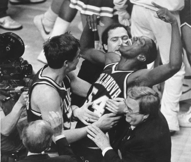 In this April 1, 1985, file photo, Villanova's Ed Pinckney (54) yells out as he is surrounded by teammates after Villanova defeated Georgetown to win the NCAA college basketball championship in Lexington, Ky. It's been 30 years since Villanova won the national championship in one of the most shocking upsets in sports history. (AP Photo/Gary Landers, File)