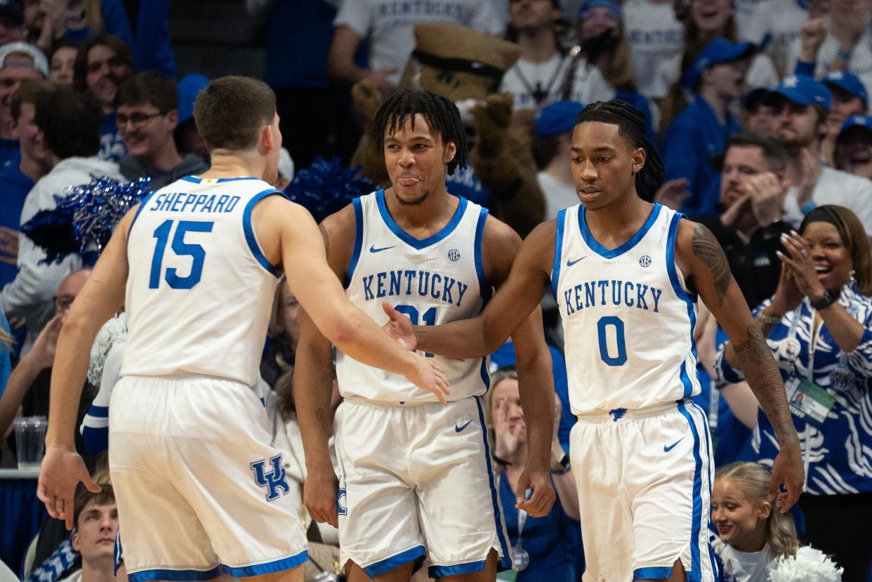 Kentucky guards Reed Sheppard (15) and D.J. Wagner (21) celebrates with fellow freshman Rob Dillingham (0) after a play during the game against Arkansas on March 2 at Rupp Arena. The Wildcats closed the regular season with seven wins in their final eight games.