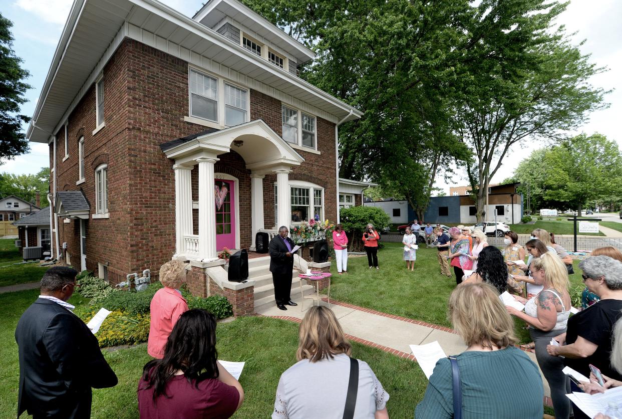 Bishop Frank Beard, center, of the United Methodist Church's Great Rivers Conference, gives the benediction during the blessing of the Wooden It Be Lovely residential house on South Grand Avenue in Springfield on Thursday June 2, 2022. Up to four women who are recovering from addiction or who have experienced poverty or abuse are expected to live in the house.