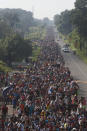 Central American migrants walking to the U.S. start their day departing Ciudad Hidalgo, Mexico, Sunday, Oct. 21, 2018. Despite Mexican efforts to stop them at the border, a growing throng of Central American migrants resumed their advance toward the U.S. border early Sunday in southern Mexico. Their numbers swelled to about 5,000 overnight. (AP Photo/Moises Castillo)