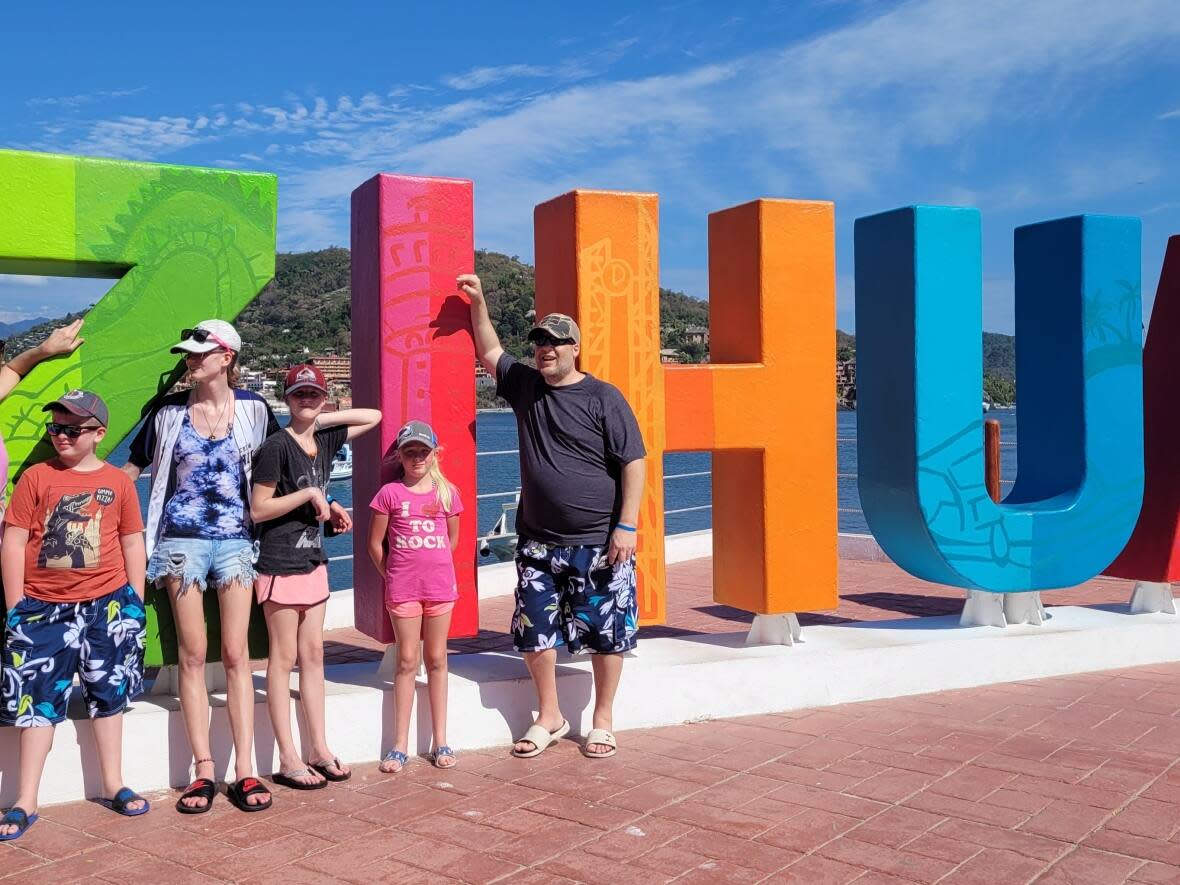 The Stone family on a previous vacation. Their 2023 trip to Mexico has not been as smooth of a ride.  (Submiited by Adrienne Stone - image credit)