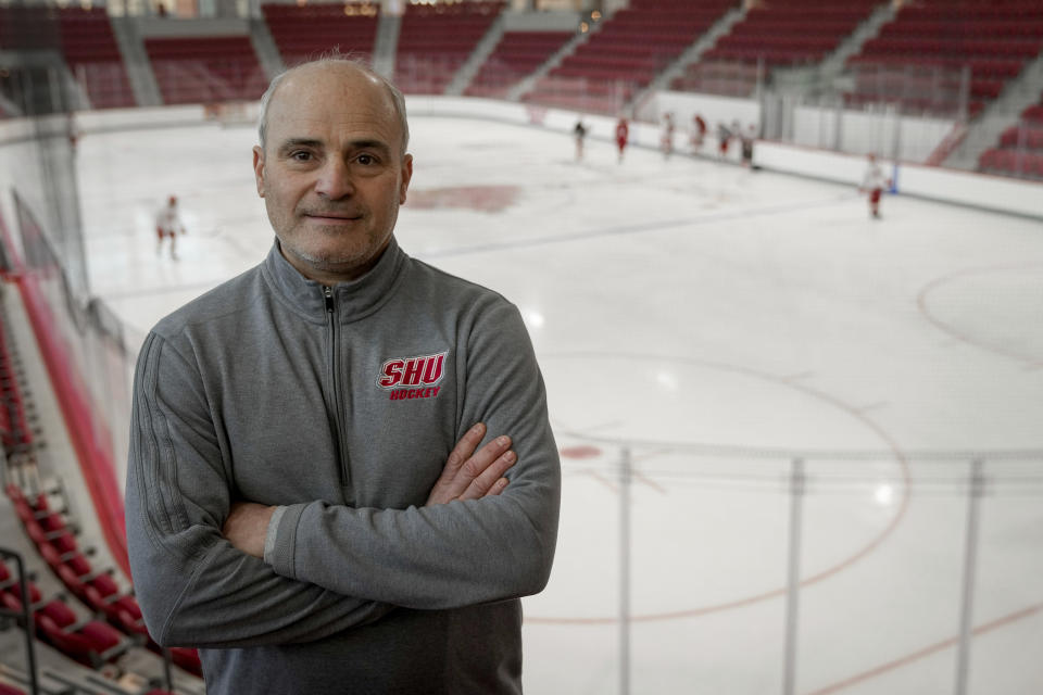 CJ Marottolo, head coach of the men's hockey team at Sacred Heart, stands in the newly constructed NCAA college hockey Martire Family Arena on the campus of Sacred Heart University in Fairfield, Conn., Monday, Jan 9, 2023. (AP Photo/Bryan Woolston)