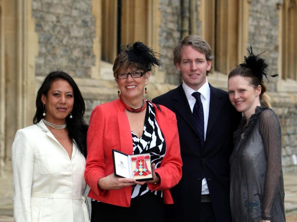 Prue Leith, with daughter Li-Da Kruger (left) and her son Danny Kruger and his wife Emma in 2010 after she received her CBE (PA)