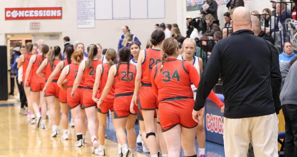 Bedford's girls basketball players shake hands with their counterparts from Lenawee Christian following Bedford's 42-21 victory on Martin Luther King Day Monday.