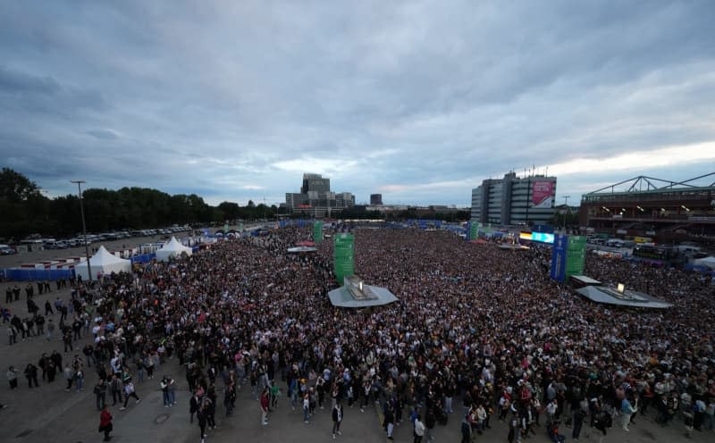 Germany fans celebrate at the public viewing area at Heiligengeistfeld as they watch the UEFA Euro 2024 Group A soccer match between Germany and Scotland. Marcus Brandt/dpa