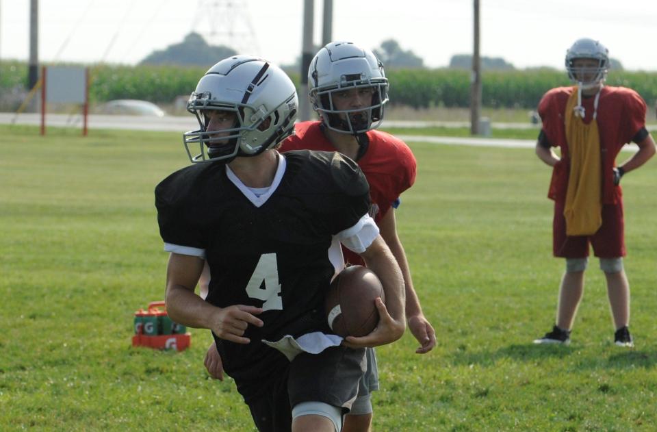 Westfall quarterback Bryce Wickline (#4) runs the ball during the Mustangs' second day of official practice of the 2023 season on Aug. 1, 2023 in Williamsport, Ohio.