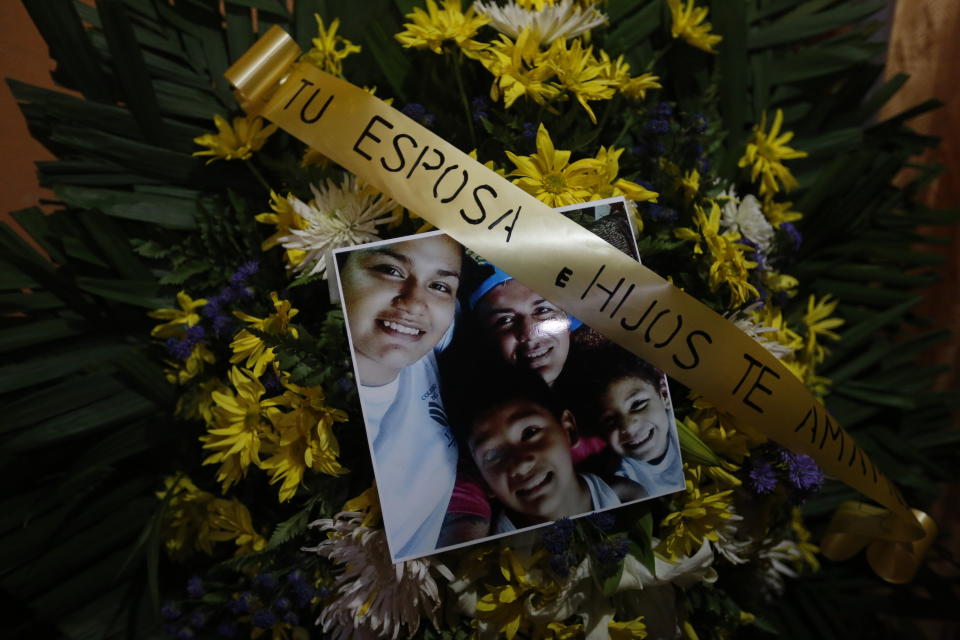 FILE - In this May 3, 2018 file photo, a floral arrangement with the words in Spanish "Your wife and children love you" stands during the funeral for Nelson Tellez, who died of gunshot wounds during the April 20 protests against the government of President Daniel Ortega, in Ciudad Sandino, Nicaragua. A group of independent international experts sent by the Inter-American Commission on Human Rights to investigate violations wrote in its December report that the killings were carried out by police and pro-government gangs unleashed against the protesters. The experts were expelled from the country before they could publicly release their report. (AP Photo/Alfredo Zuniga, File)