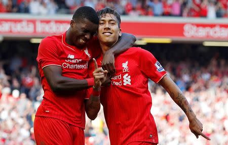 Britain Soccer Football - Liverpool v Watford - Barclays Premier League - Anfield - 8/5/16 Roberto Firmino celebrates with Sheyi Ojo after scoring the second goal for Liverpool Reuters / Phil Noble Livepic EDITORIAL USE ONLY.