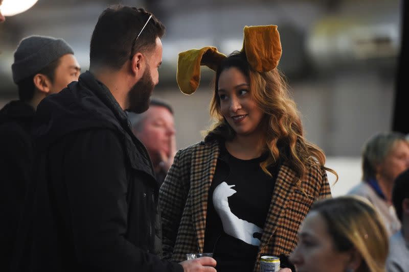 A woman wears dog ears during the Masters Agility Championship during the Westminster Kennel Club Dog Show in New York