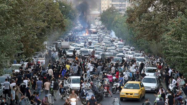 PHOTO: Protesters chant slogans during a protest over the death of a woman who was detained by the morality police in downtown Tehran, Iran, Sept. 21, 2022. (via AP)