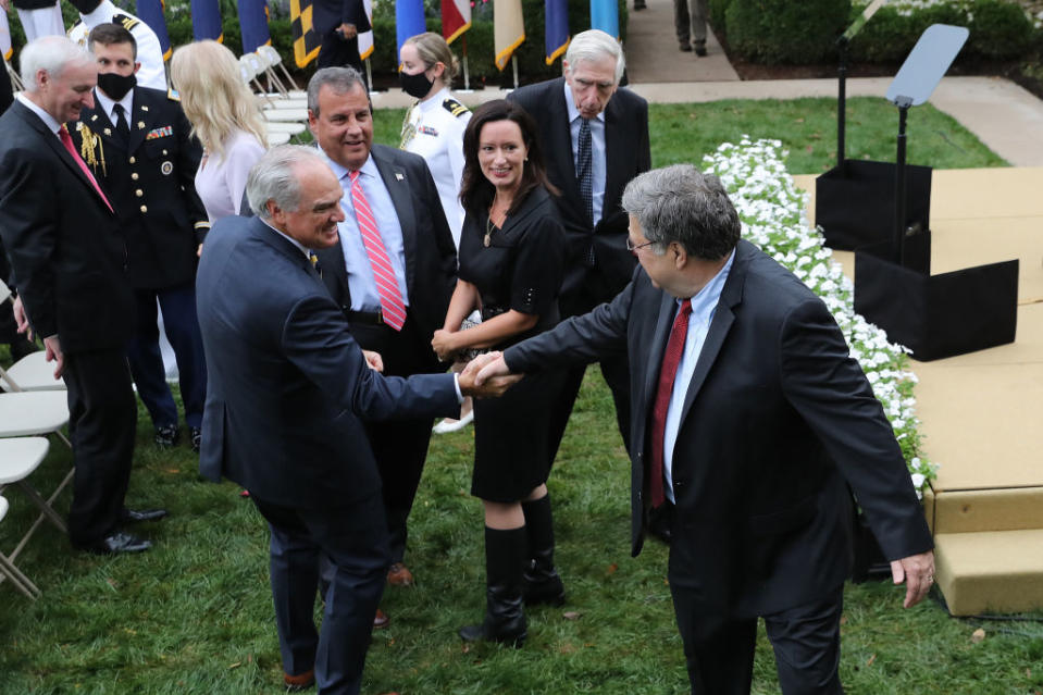 Attorney General William Barr says goodbye to former New Jersey Governor Chris Christie and other guests after President Donald Trump introduces 7th U.S. Circuit Court Judge Amy Coney Barrett, 48, as his nominee to the Supreme Court in the Rose Garden at the White House September 26, 2020 in Washington, DC.<span class="copyright">Photo by Chip Somodevilla/Getty Images</span>