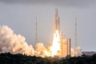 Arianespace's Ariane 5 rocket with NASA’s James Webb Space Telescope onboard lifts up from the launchpad, at the Europe’s Spaceport, the Guiana Space Center in Kourou, French Guiana, on December 25, 2021 (AFP/jody amiet)