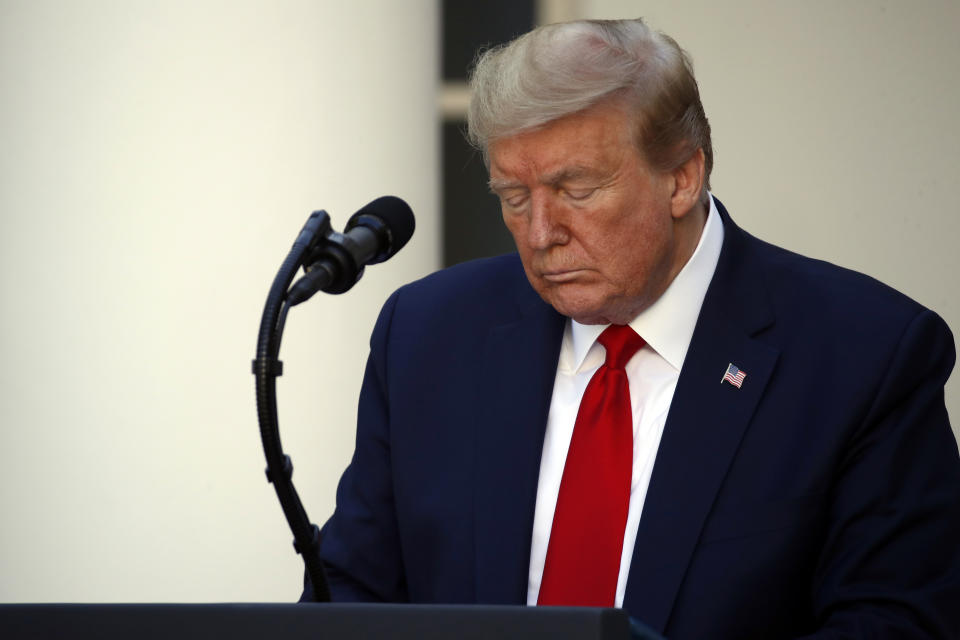 President Donald Trump closes his eyes as he prays during a White House National Day of Prayer Service in the Rose Garden of the White House, Thursday, May 7, 2020, in Washington. (AP Photo/Alex Brandon)