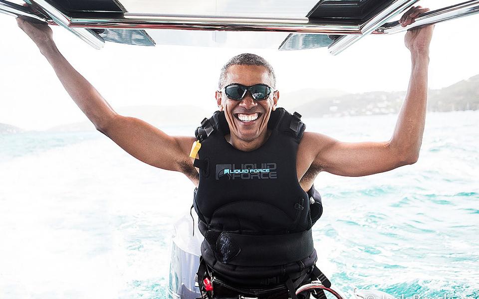 Undated handout photo issued by Virgin.com of former President of the United States Barack Obama who learnt to kitesurf on the British Virgin Islands after he finished his second term as President - Credit: Jack Brockway/Virgin.com