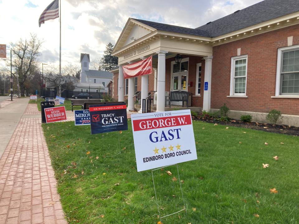 Election signs are posted Tuesday outside Edinboro's community building, one of two polling places in the borough.