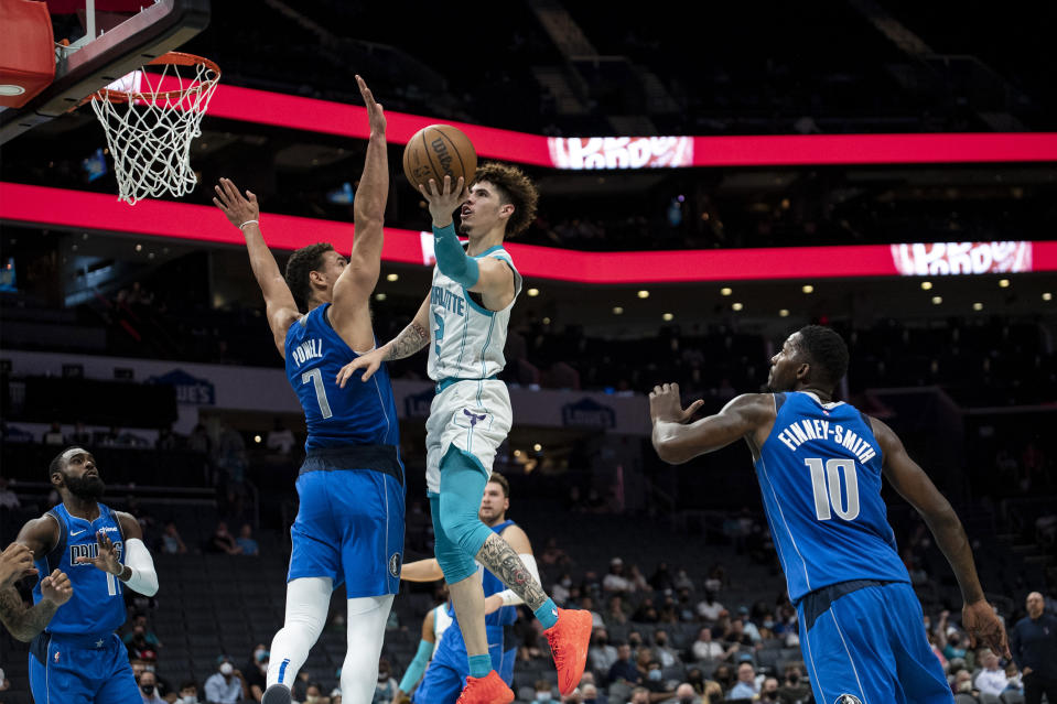 Charlotte Hornets guard LaMelo Ball (2) shoots during the first half of the team's NBA preseason basketball game against the Dallas Mavericks, Wednesday, Oct. 13, 2021, in Charlotte, N.C. (AP Photo/Matt Kelley)