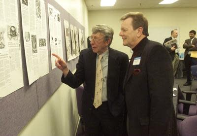 Home News Tribune editor Dick Hughes, left, speaks with George Bandics of East Brunswick during a luncheon for letter writers at the newsroom on Feb. 15, 2000.