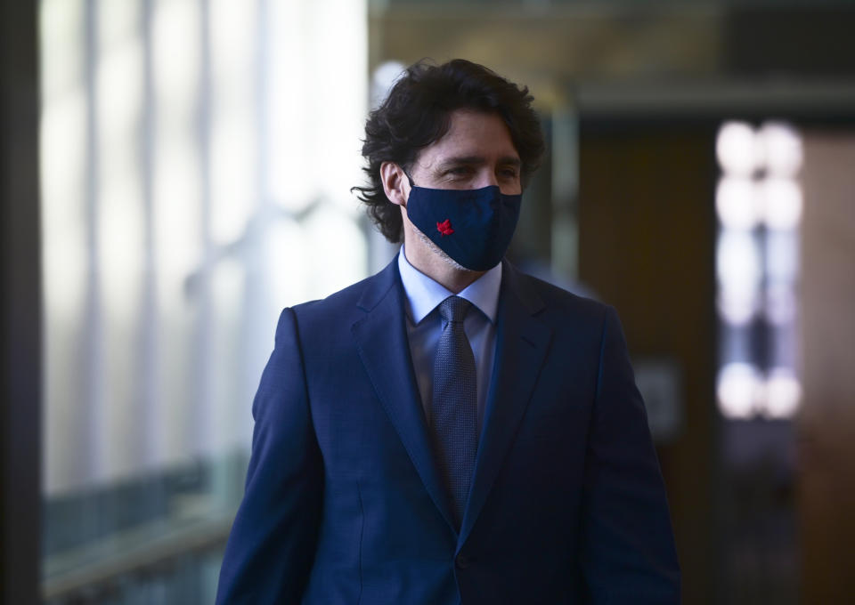 Canadian Prime Minister Justin Trudeau makes his way to hold a press conference in Ottawa, Ontario, Friday, March 5, 2021. (Sean Kilpatrick/The Canadian Press via AP)