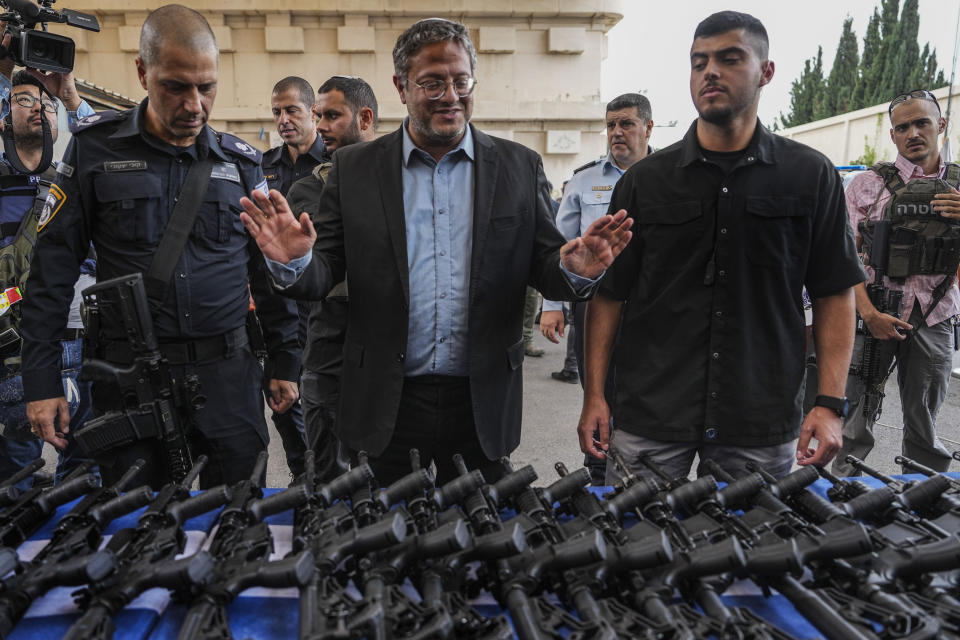 Israel's National Security Minister Itamar Ben-Gvir attends an event to deliver weapons to local volunteer security group members in Ashkelon, Israel, Friday, Oct. 27, 2023. (AP Photo/Tsafrir Abayov)