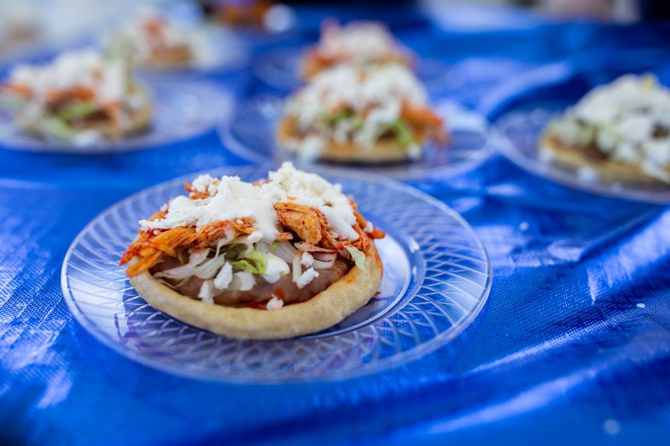 Sopes, hand pressed tortillas topped with beans, meat lettuce and cheese are served at La Tiendita's tent during the Cleaver and Cork event at TCC on Saturday, March 6, 2021. 