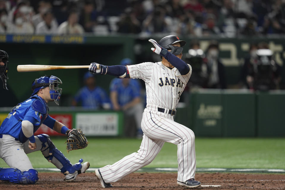 Masataka Yoshida of Japan hits a solo home run during the seventh inning of the quarterfinal game between Italy and Japan at the World Baseball Classic (WBC) at Tokyo Dome in Tokyo, Japan, Thursday, March 16, 2023. (AP Photo/Toru Hanai)