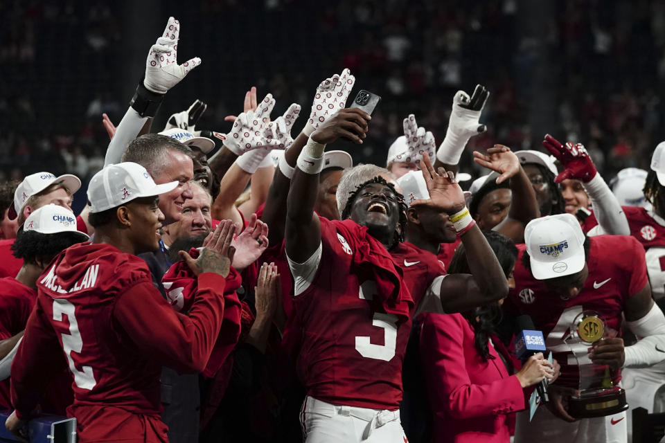 Alabama celebrates after a win against Georgia after the Southeastern Conference championship NCAA college football game in Atlanta, Saturday, Dec. 2, 2023. (AP Photo/John Bazemore)