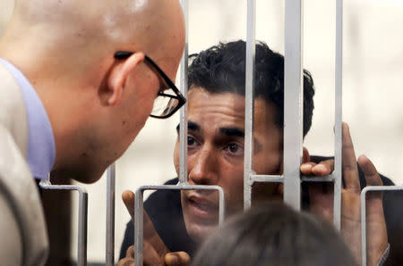 Mohammed Ali Malek (R) speaks with his lawyer Massimo Ferrante at Catania's tribunal, April 24, 2015. REUTERS/Antonio Parrinello/File Photo