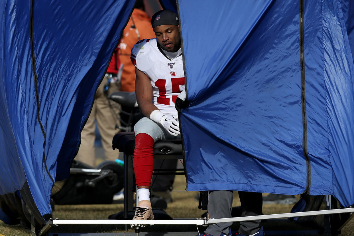 CHICAGO, ILLINOIS - NOVEMBER 24: Golden Tate #15 of the New York Giants is tested for a concussion after taking a hit in the first quarter against the Chicago Bears at Soldier Field on November 24, 2019 in Chicago, Illinois. (Photo by Dylan Buell/Getty Images)