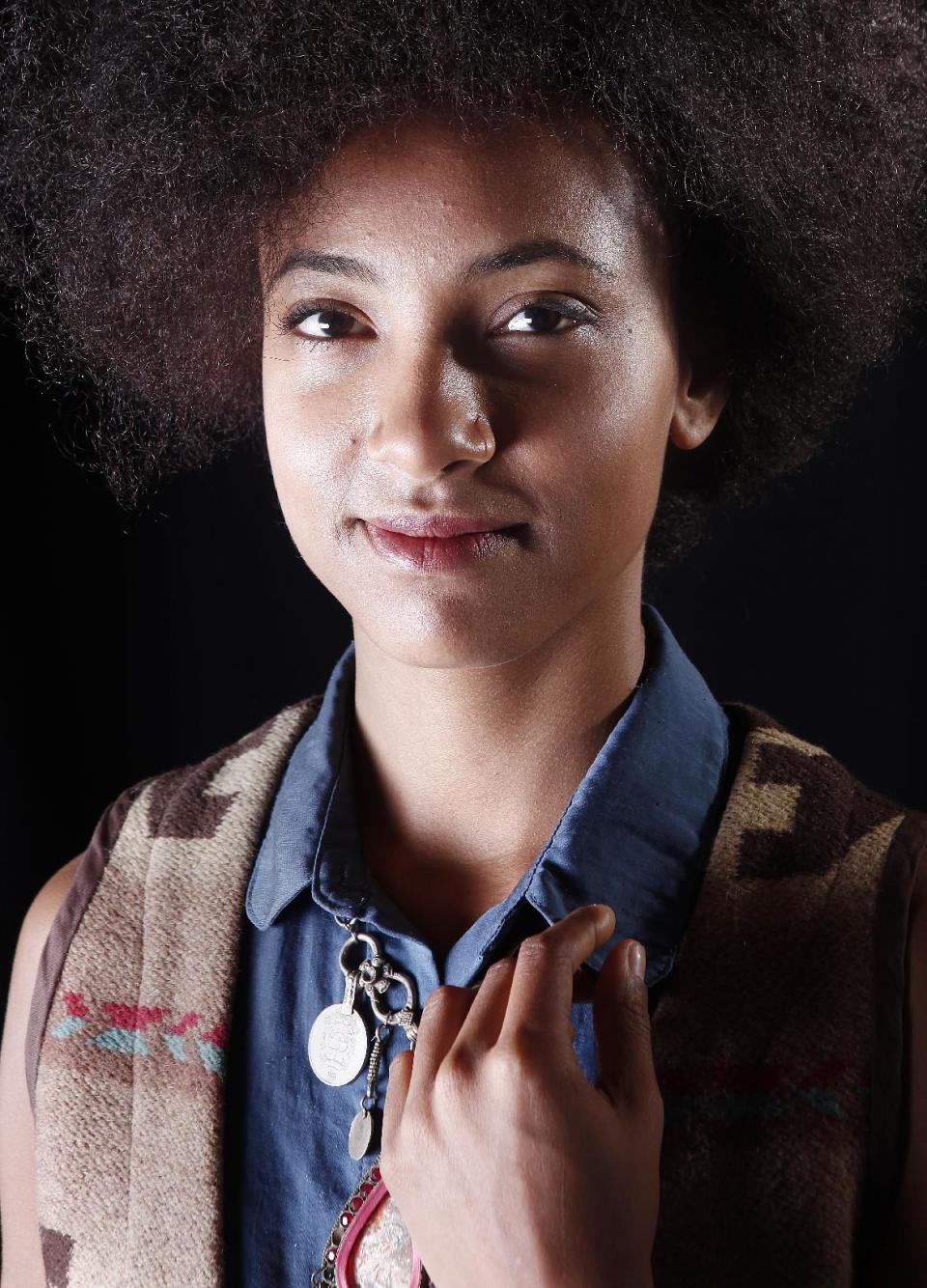 FILE - In this March 1, 2012 photo, musician Esperanza Spalding poses for a portrait in New York. Spalding's latest album, "Radio Music Society," was released this week. (AP Photo/Carlo Allegri, file)