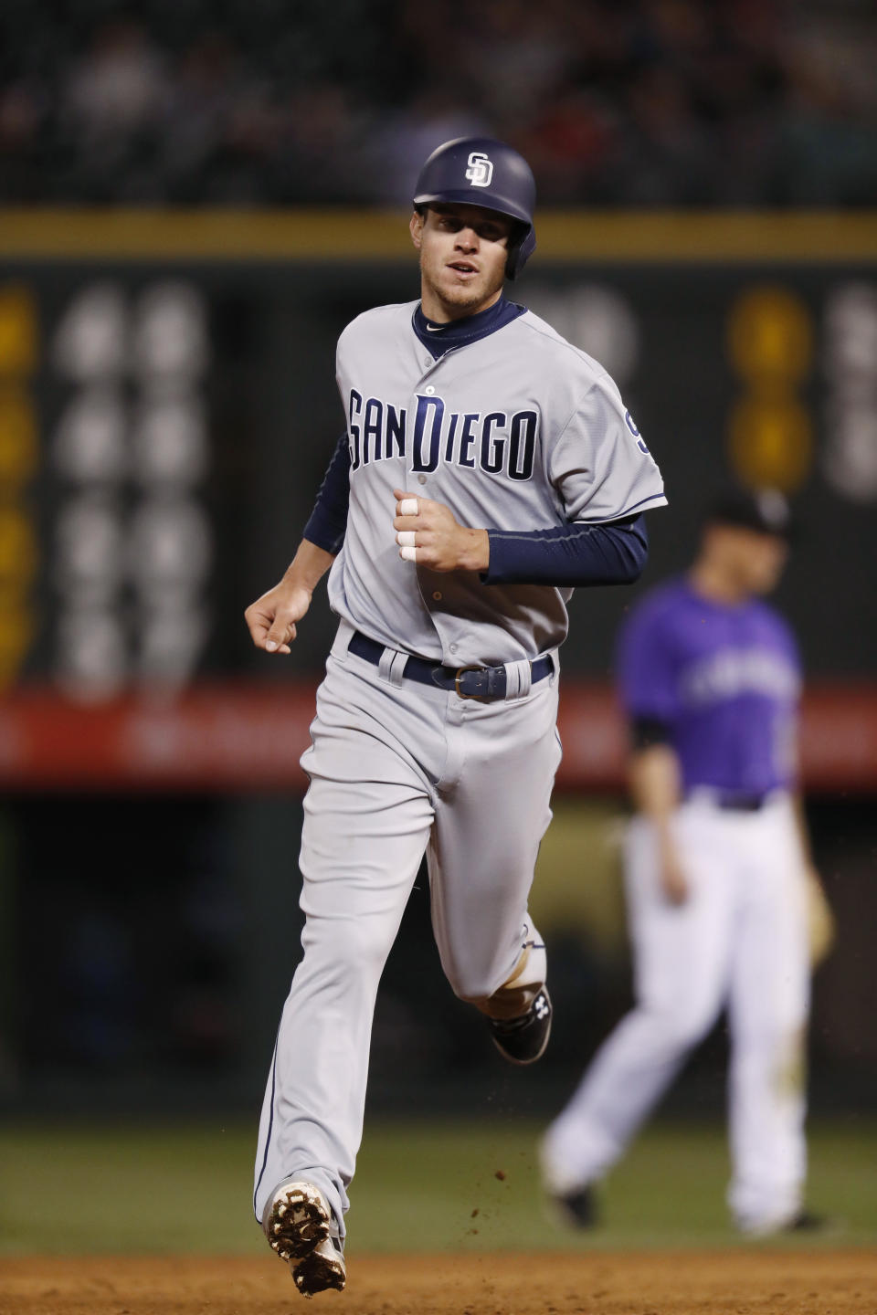 San Diego Padres' Wil Myers circles the bases after a solo home run to lead off the sixth inning off Colorado Rockies starting pitcher Tyler Chatwood in a baseball game Monday, April 10, 2017, in Denver. The Padres won 5-3. (AP Photo/David Zalubowski)