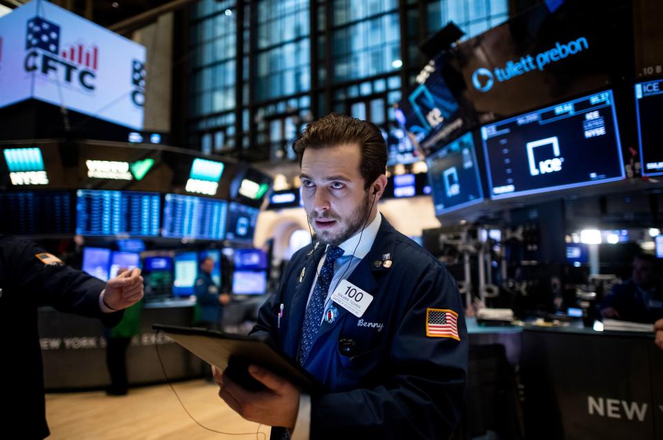 Traders work during the opening bell at the New York Stock Exchange (NYSE) on January 13, 2020 on Wall Street in New York City. - Wall Street stocks rose early Monday in anticipation of the expected signing of a US-China trade accord and a trove of earnings from financial heavyweights. Sentiment was upbeat ahead of the signing set for January 15, 2020 of the long-in-the-making trade accord between Washington and Beijing. (Photo by Johannes EISELE / AFP) (Photo by JOHANNES EISELE/AFP via Getty Images)