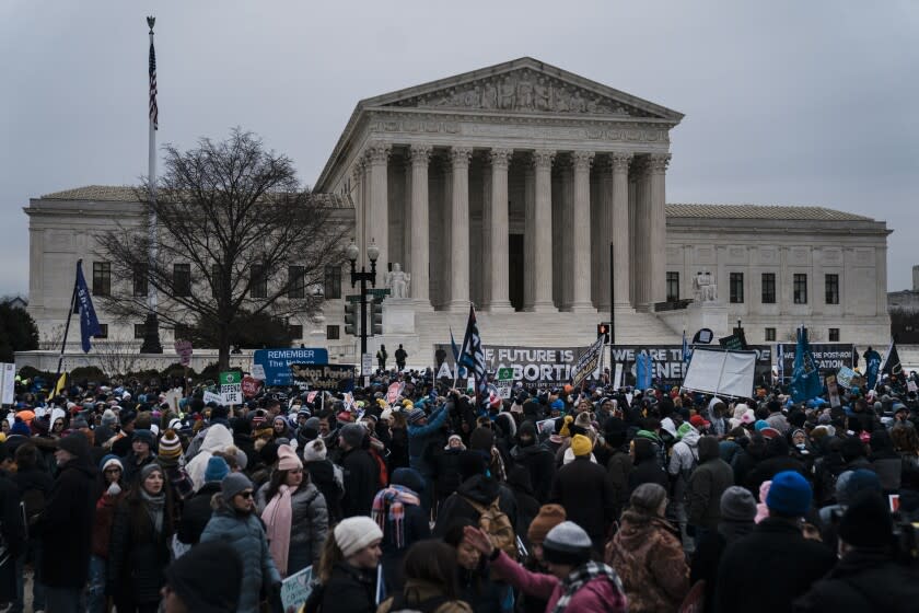 WASHINGTON, DC - JANUARY 21: Anti-abortion activists and supporters march along Constitution Ave, with their final destination being the Supreme Court of the United States during the 49th annual March for Life along Constitution Ave. on Friday, Jan. 21, 2022 in Washington, DC. (Kent Nishimura / Los Angeles Times)