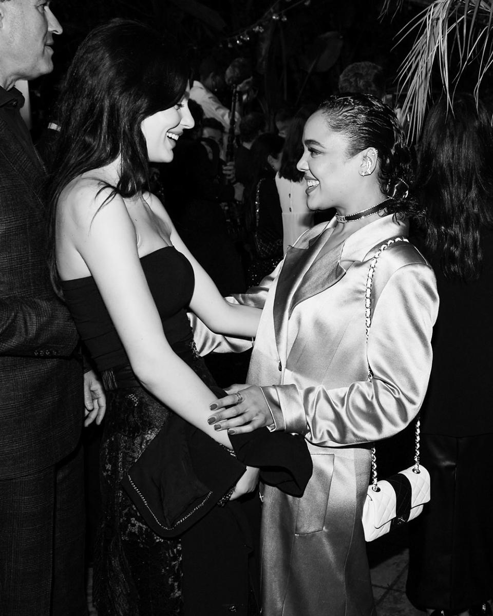 Camila Morrone and Tessa Thompson attend Chanel and Charles Finchs 14th annual pre Oscars dinner