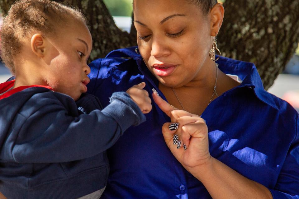 Renee Milam, 36, holds her son A'Zion, who was born with Down syndrome. A'Zion died Nov. 26.