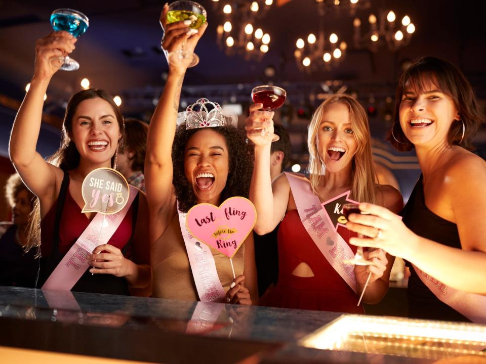 A group of women at a bar for a bachelorette party.