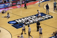 Players warm up on the court before the start of a First Four game between Texas Southern and Mount St. Mary's in the NCAA men's college basketball tournament, Thursday, March 18, 2021, in Bloomington, Ind. (AP Photo/Doug McSchooler)
