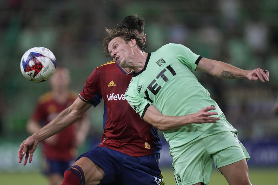 Austin FC midfielder Alexander Ring, right, heads the ball past Real Salt Lake midfielder Damir Kreilach during the second half of an MLS soccer match in Austin, Texas, Saturday, June 3, 2023. (AP Photo/Eric Gay)