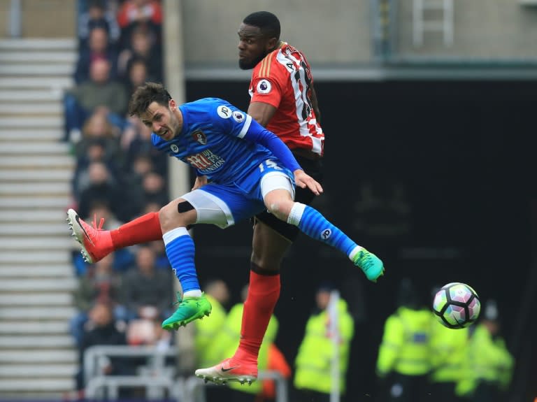 Sunderland's Victor Anichebe (R) challenges Bournemouth's English defender Adam Smith (L) during their Premier league match at the Stadium of Light in Sunderland, north-east England on April 29, 2017