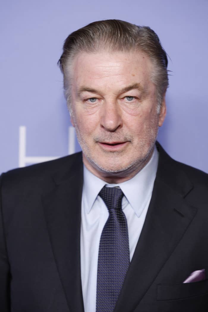 A closeup of Alec Baldwin in a suit and tie