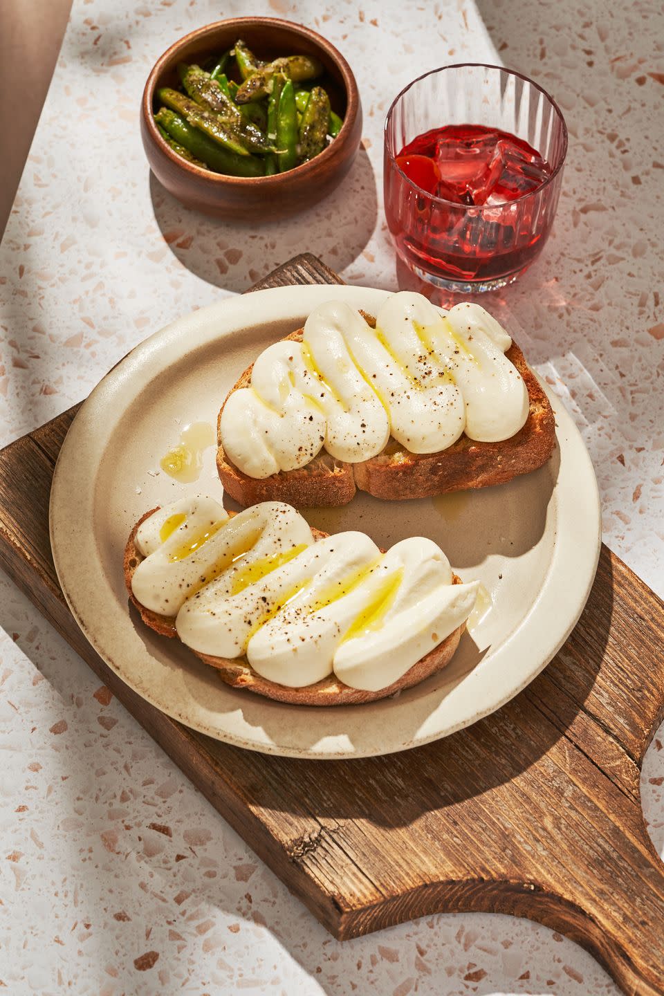 <p>This light, fluffy whipped ricotta is as close as you can get to eating a cloud.</p><p>Get the recipe from <a href="https://www.delish.com/cooking/a36276712/whipped-ricotta-toast-recipe/" rel="nofollow noopener" target="_blank" data-ylk="slk:Delish;elm:context_link;itc:0;sec:content-canvas" class="link ">Delish</a>.</p>